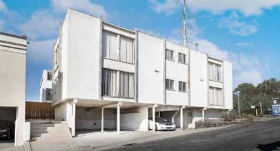 Apartment building exterior before renovation